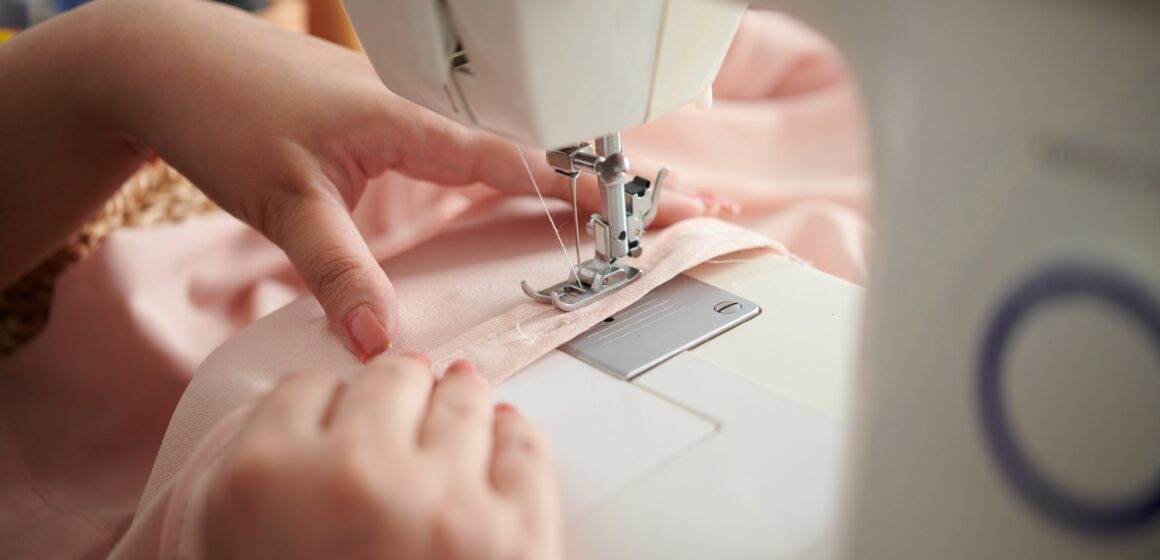 Seamstress Sewing Silk Dress