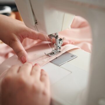Seamstress Sewing Silk Dress