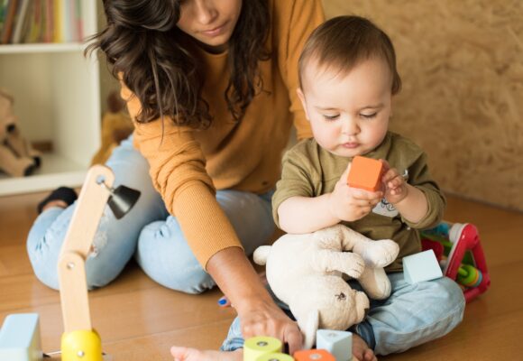 Mother playing with her baby