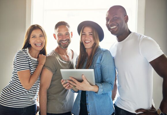 Smiling confident informal young businesspeople